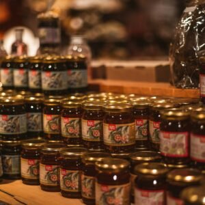 red and yellow glass jars on brown wooden table